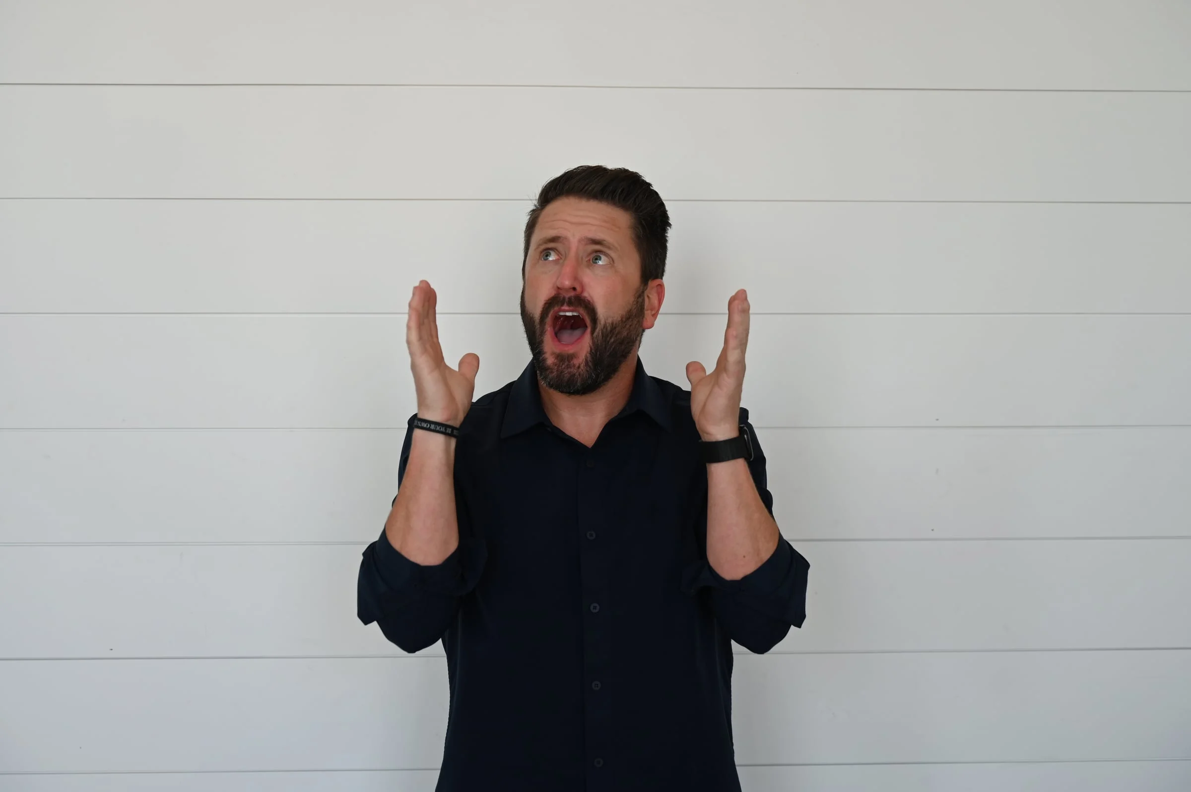 Wayne Salmans with his hands raised in exasperation